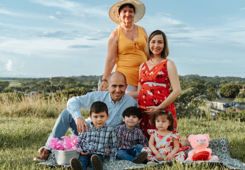 Generational family enjoying a sunny day picnic in La Dorada, Caldas.